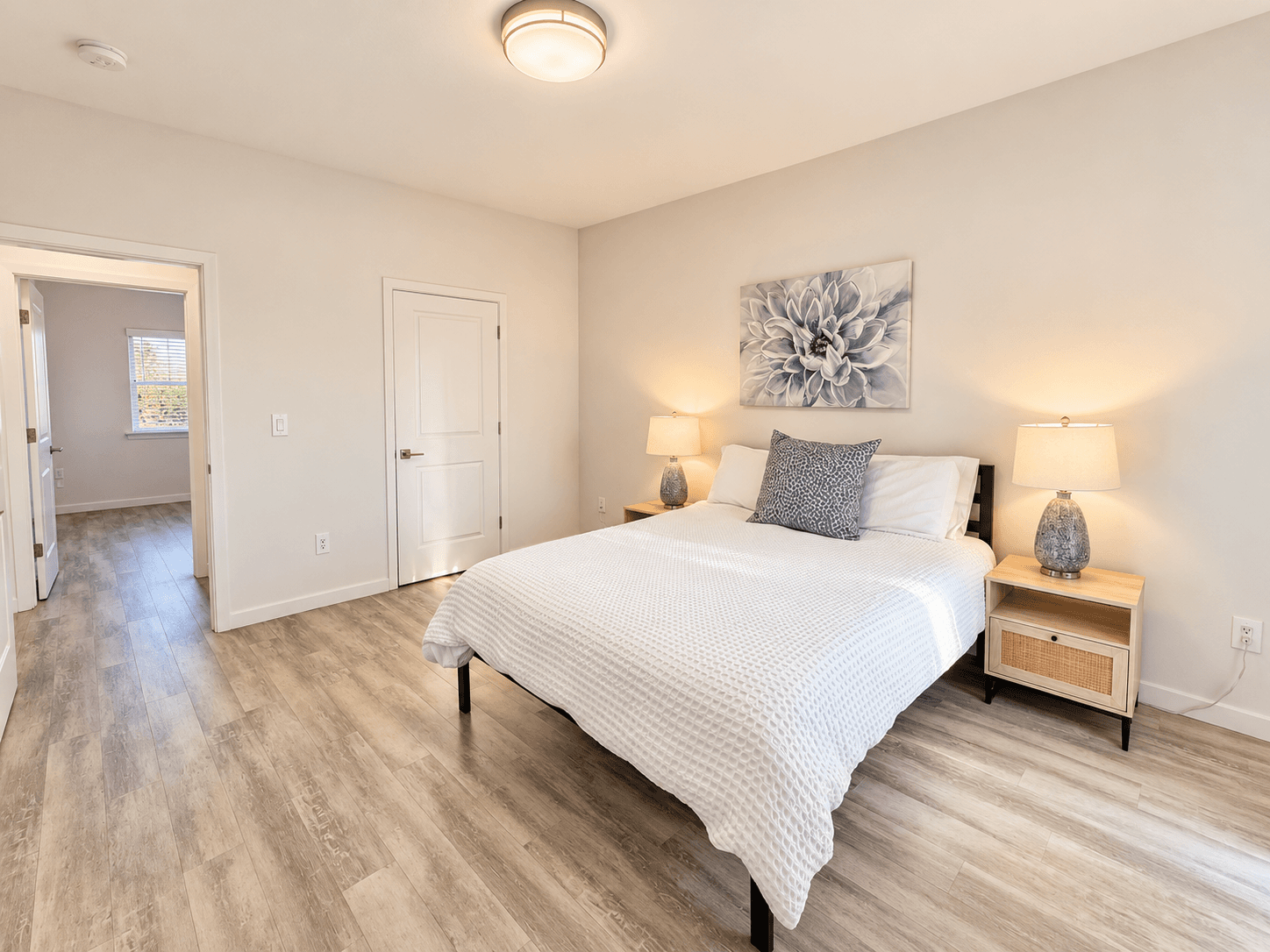 Cabernet Suite primary queen bedroom with patio access