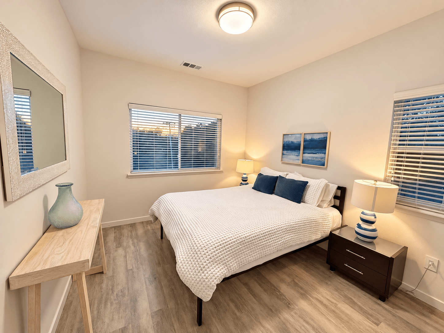 Chardonnay Suite primary queen bedroom with windows