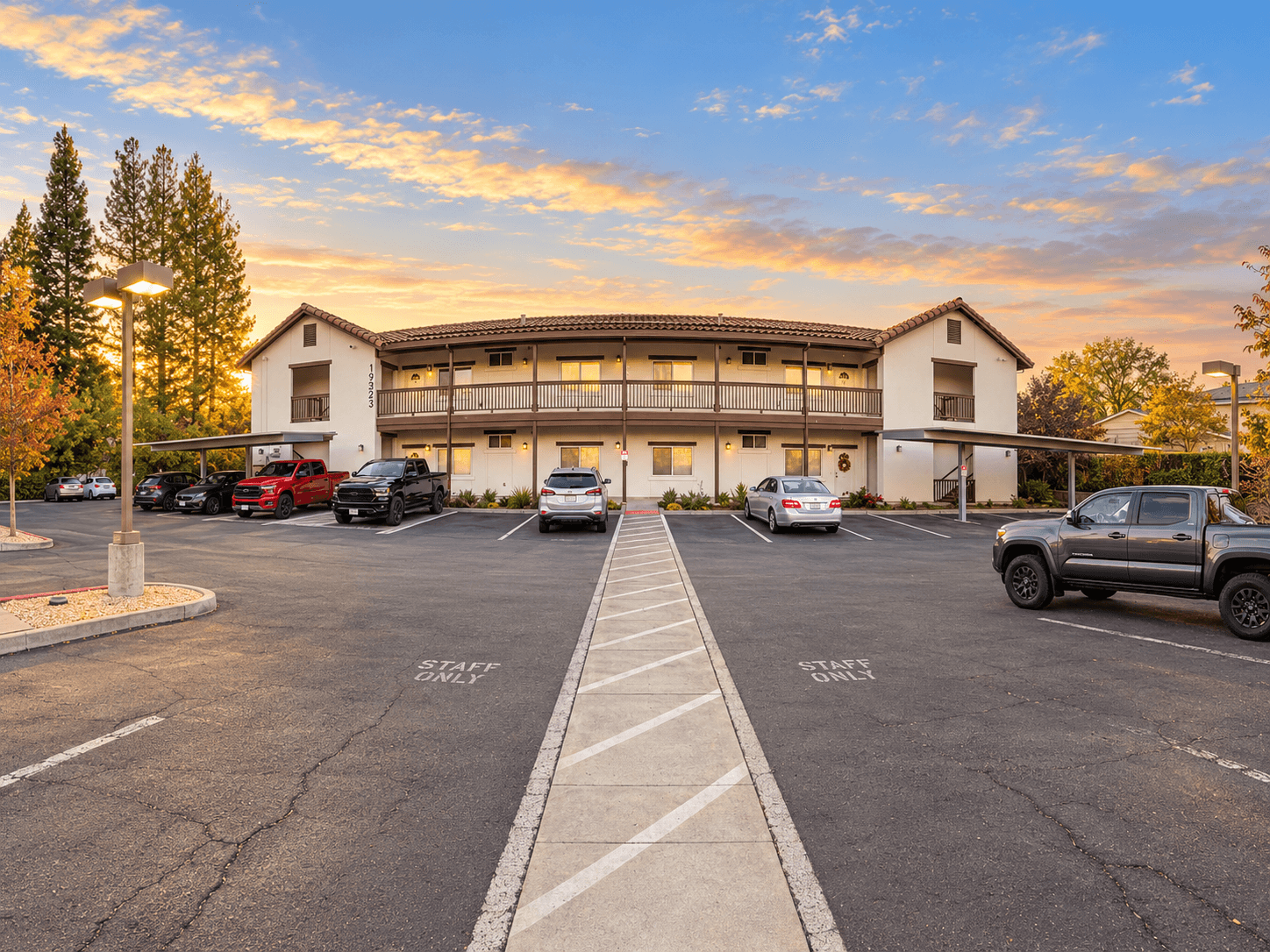 Sonoma Grove Suites two-story vacation rental building at sunset in Sonoma, California