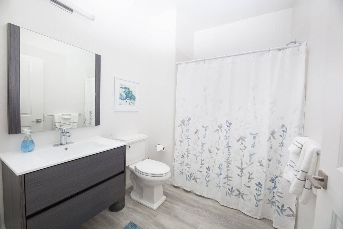 ADA-compliant bathroom with shower/tub combo, designed for comfort.