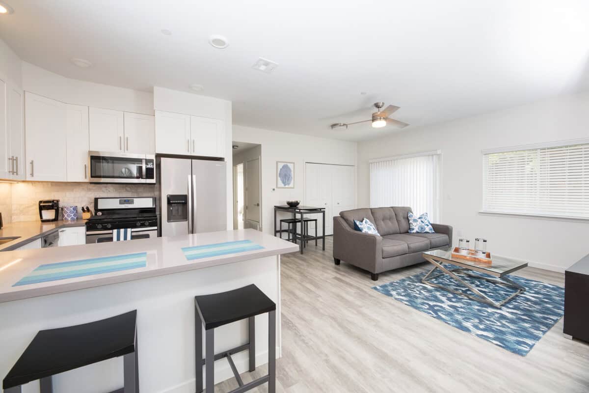 Full-service kitchen with seamless flow to living area and patio.